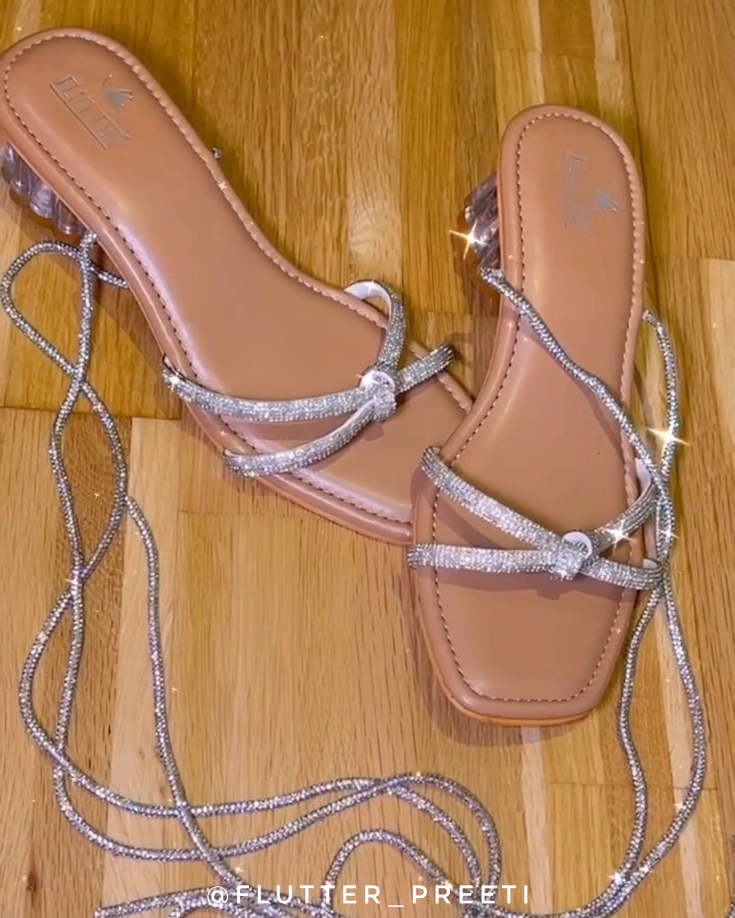 All tangled up tie up silver glass heels
